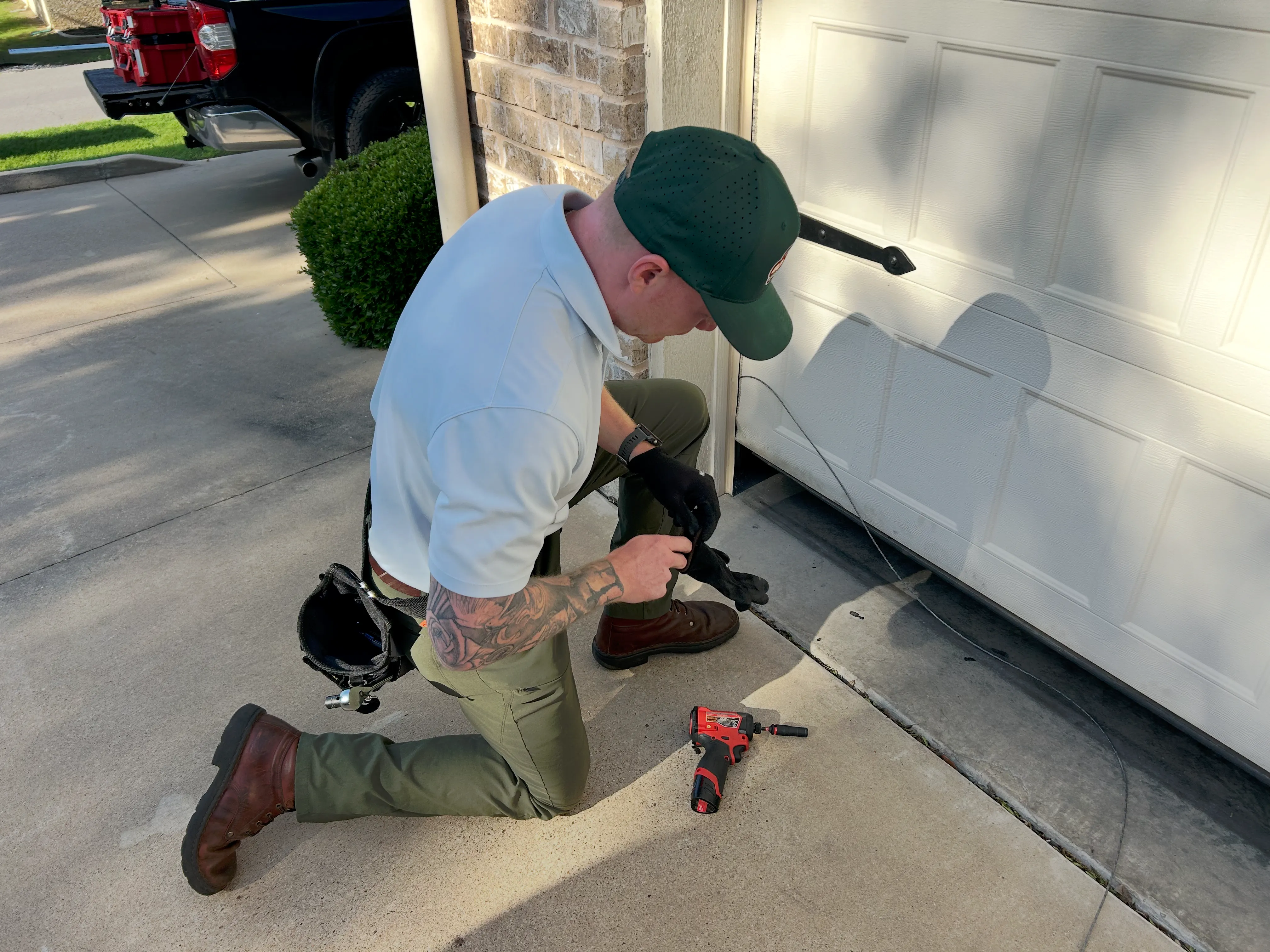 Go Nuts Garage Door technician repairing a garage door in Benbrook, TX