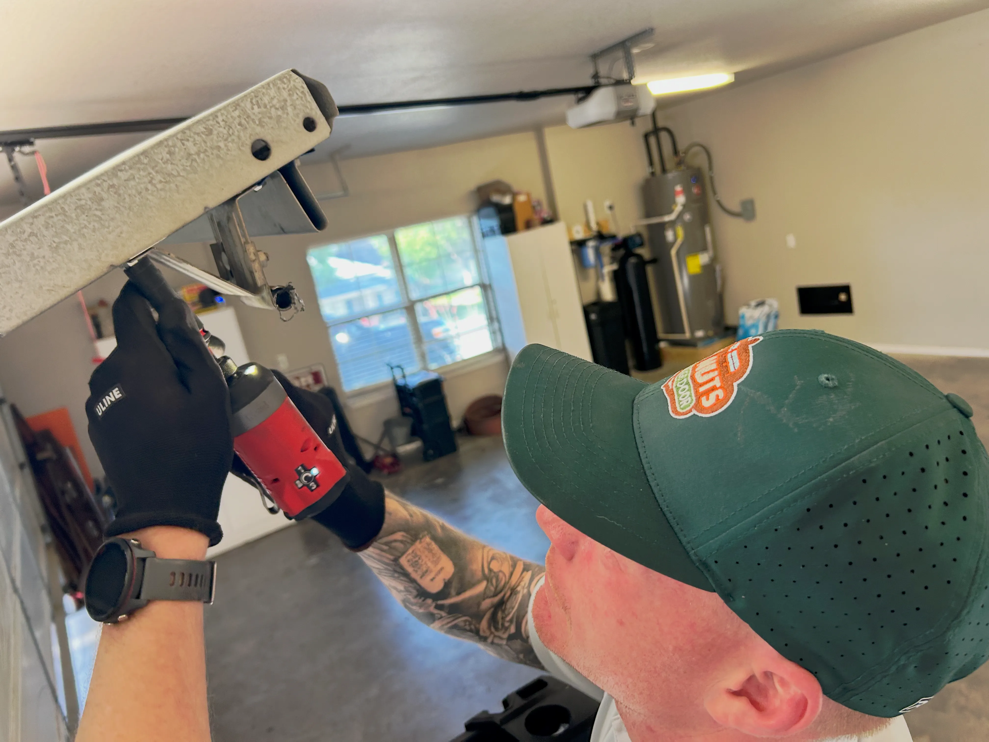 Go Nuts Garage Door technician installing a garage door opener in Aledo, TX