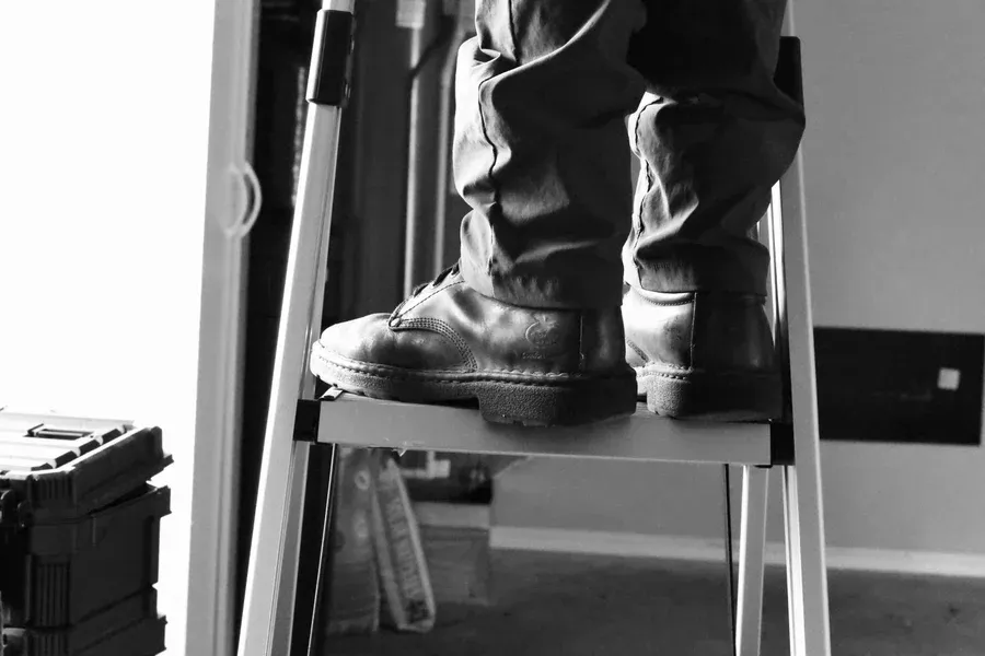 Go Nuts Garage Door technician repairing a garage door in DeCordova, TX