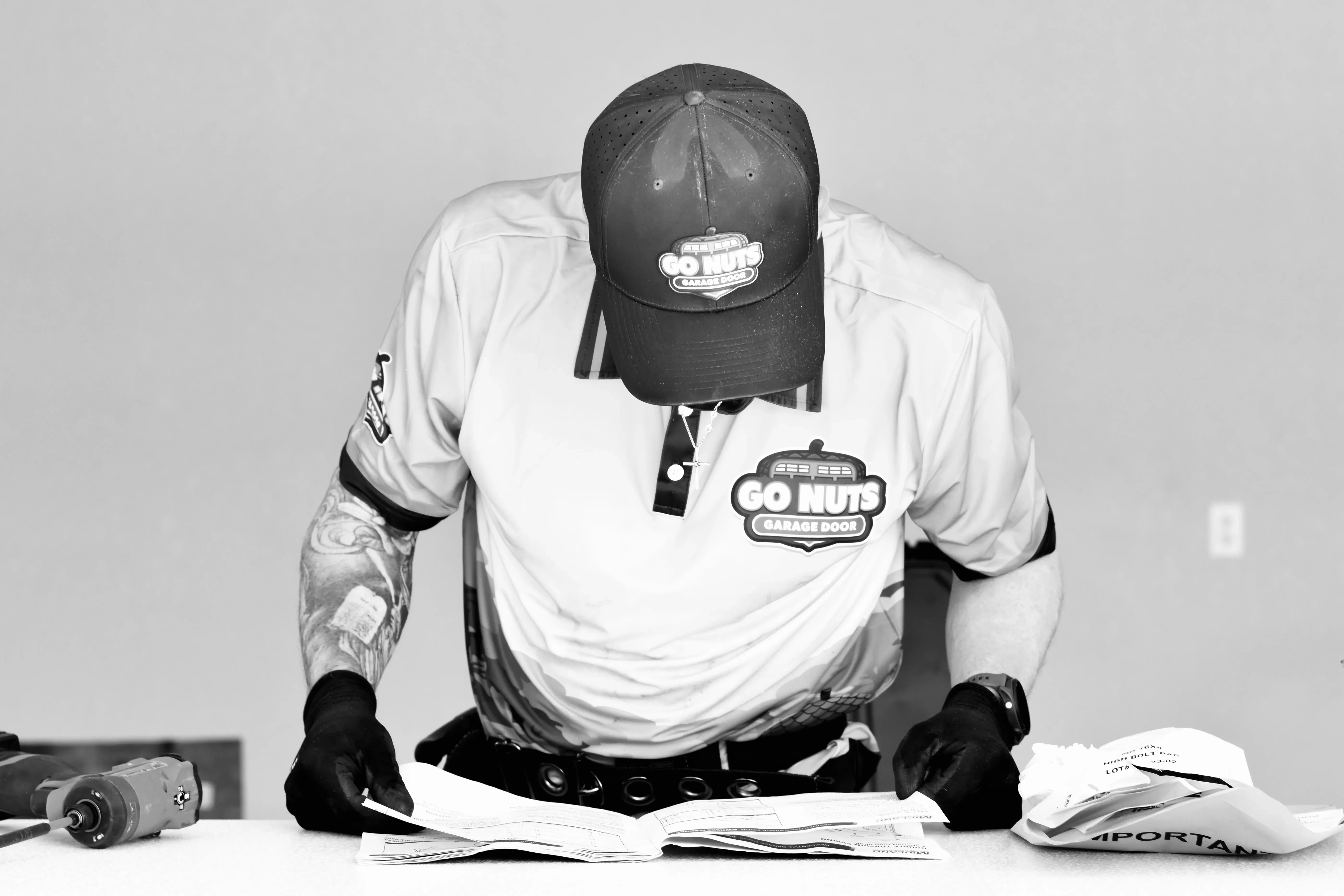 Go Nuts Garage Door technician servicing a garage door in Cleburne, TX