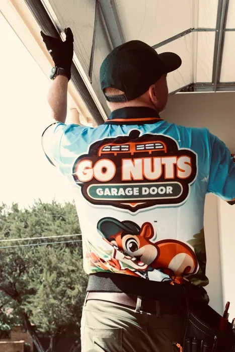 Go Nuts Garage Door technician installing a garage door opener in Cleburne, TX