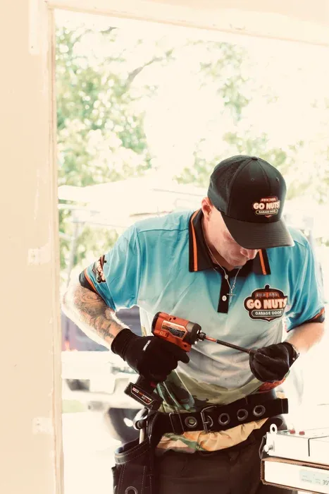 Go Nuts Garage Door technician replacing garage door weatherstripping in Weatherford, TX