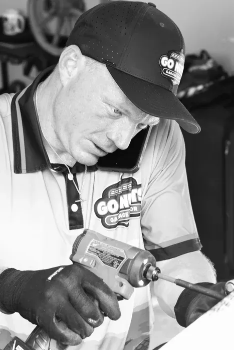 Go Nuts Garage Door technician installing a garage door opener in Granbury, TX
