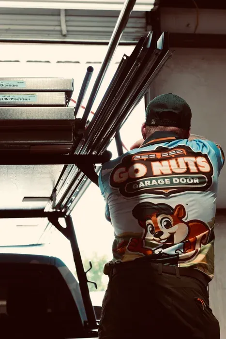 Go Nuts Garage Door technician installing a garage door opener in Aledo, TX
