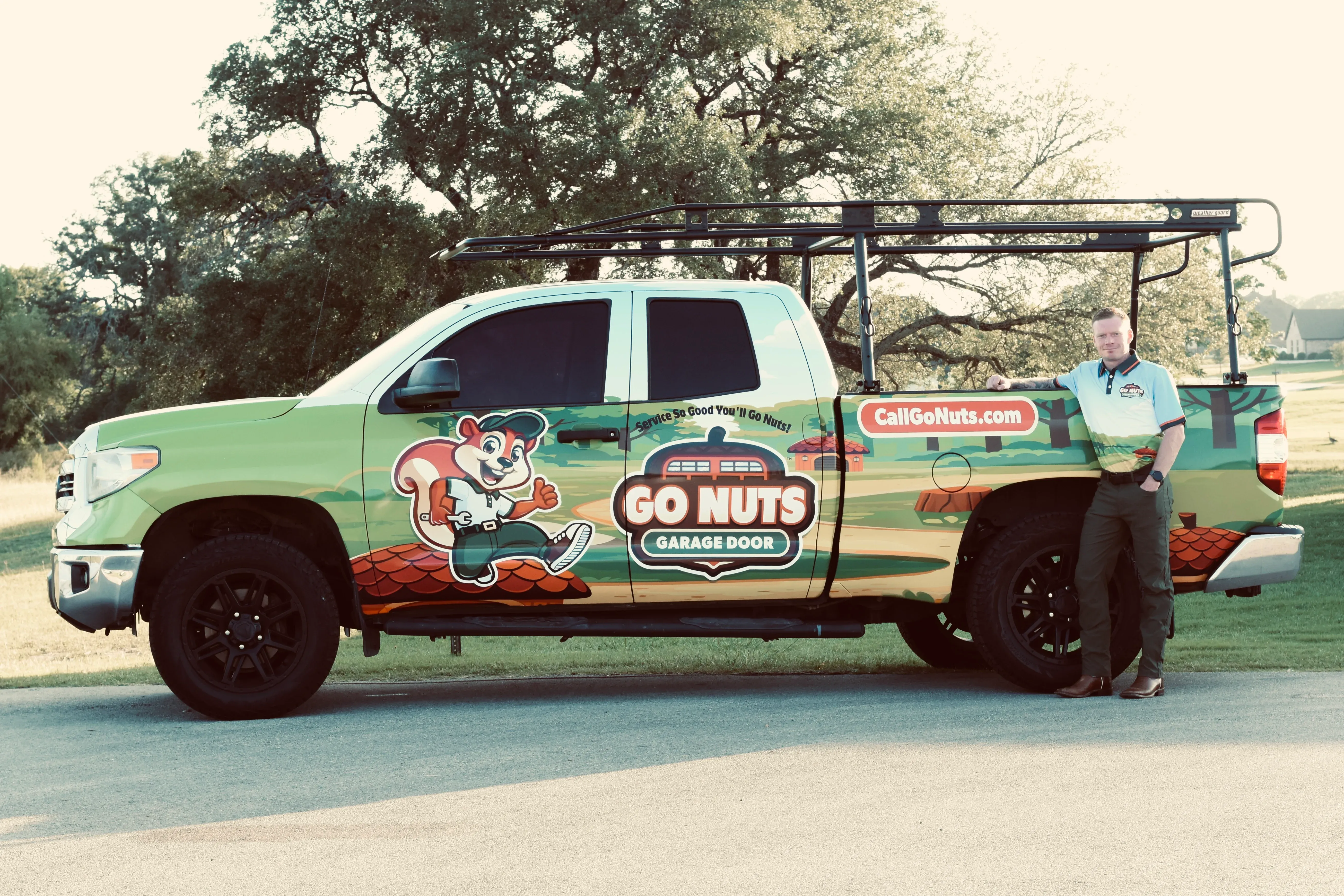 Go Nuts Garage Door technician inspecting a garage door panel in Cleburne, TX