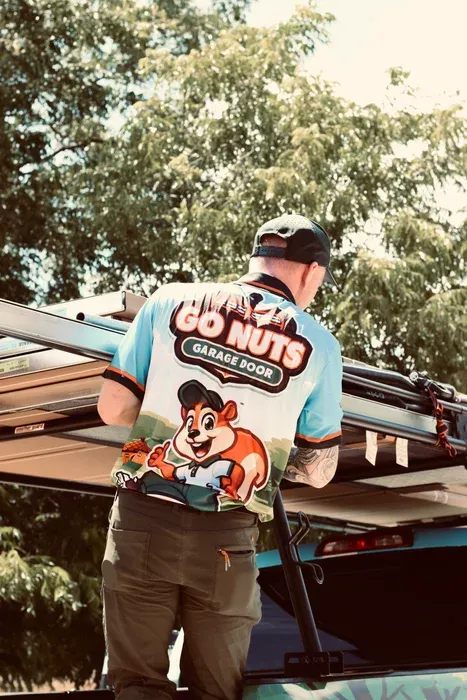 Go Nuts Garage Door technician installing a garage door opener in DeCordova, TX