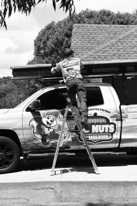 Go Nuts Garage Door technician installing a garage door opener in Pecan Plantation, TX